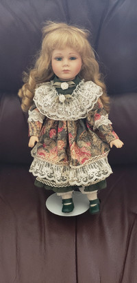 Porcelain doll on stand