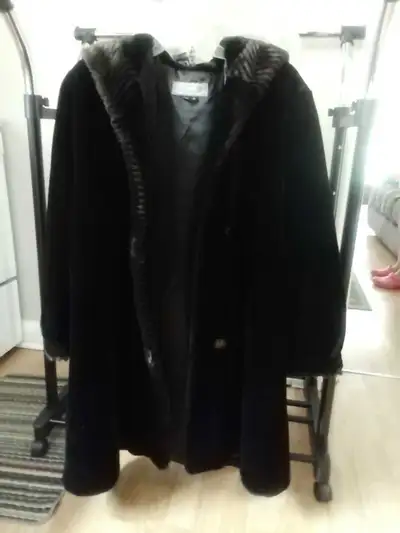 I am selling a faux fur hooded black coat, size 12 approximately knee length. Asking $40.00 or best...