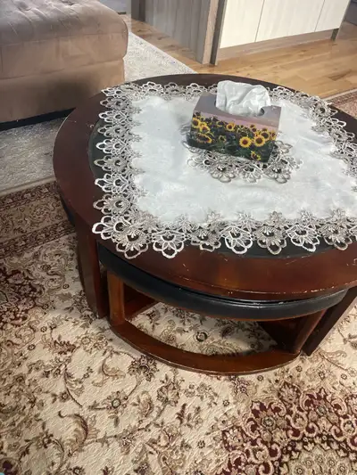 A 4 pices coffee table with the main big table. Dark brown tone and black. please contact for any mo...