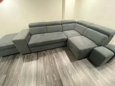 Sectional Sofa bed- Pull out bed with two additional bar seats , storage space . Adjustable headrest