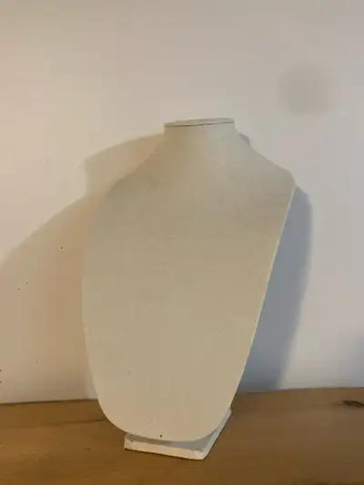 Barely used stand for either making or keeping jewellery, particularly necklaces. Beige colour.