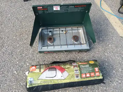 Camp stove and tent tent is brand new and stove isused, View more