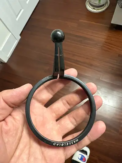 This is a used Hasselblad lens holder ring in good condition, perfect for your vintage camera setup....