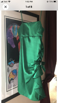 Emerald green satin party dress with side ruffle and bow size 4