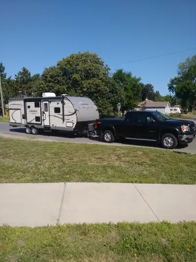 This trailer is a 28 ft 3 in with two tip outs and outside kitchen, Many many built in options as we...