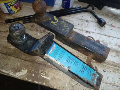 Two trailer hitch receivers and balls., View more
