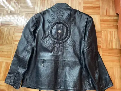 Harley Davidson Men's Wilie G black leather riding jacket with hand-braided wheel design and sterlin...
