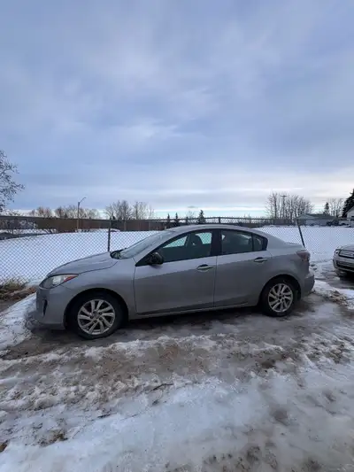 Mazda 3, 4 door sedan. Automatic. 235000km. Cool little car. Unfortunately engine was ran low on oil...