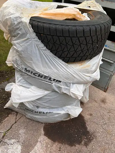 Four winter tires for sale. Size 245/45R17 107S. They're in decent condition for winter driving.