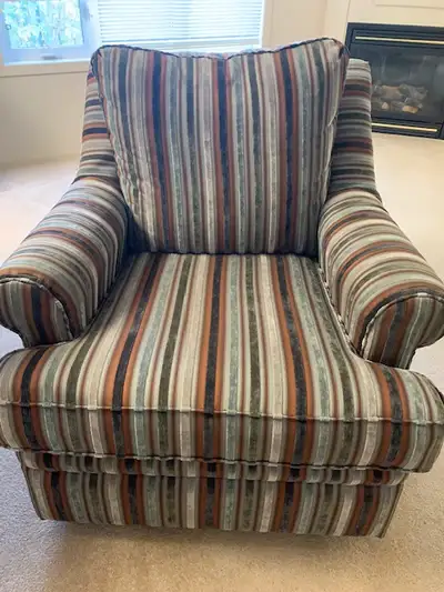 Comfy swivel rocker chair. Upholstery in excellent condition.