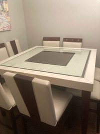 Glass top dining table with 8 chairs 