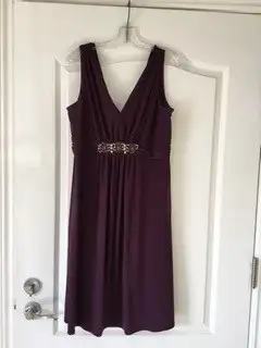 Plum dress by Bandolino, size 14-16. Gathered waist with rhinestone detail in front. Includes 4-piec...