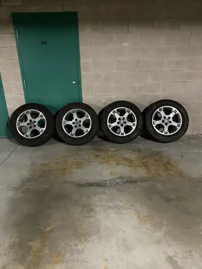 4 x 245/60/18 a/s tires on Honda rims, 5 x 114.3 bolt pattern, great condition, tires are 8/32 , no...