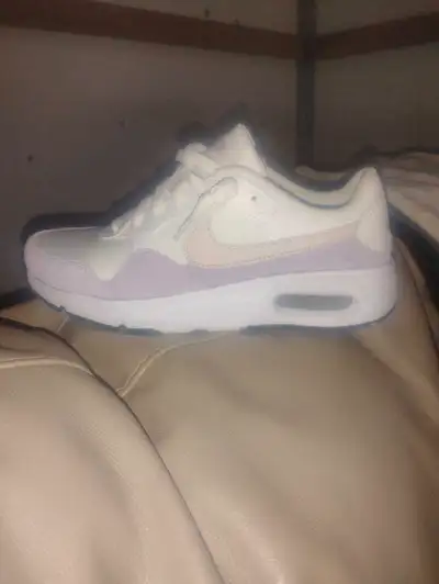 Brand new White ,pink and purple Nike air runners for women's Size U.S. - 7.5 Asking $125 OBO Can be...