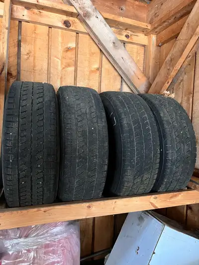 Set of four Bridgestone Blizzak LT265/70R17 snow tires mounted on 1 year old dodge steel rims. Two t...