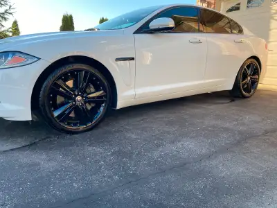 Refinished 20in Jaguar Kalimnos rims, finished in a dark metallic grey in March 2024 for $1000 at Un...