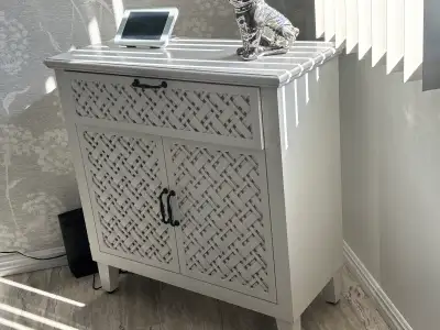 This charming, used cabinet offers both style and functionality, making it a versatile addition to a...