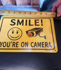 I have 4 these available 4 metal signs smile your on camera size