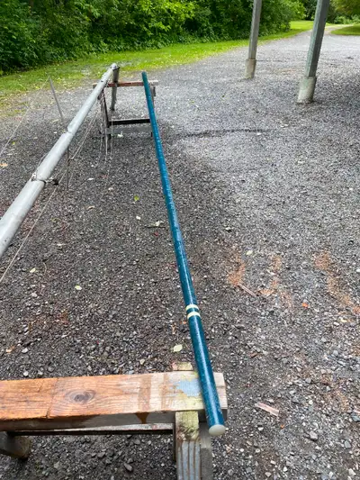 WIndsurfer fibreglass mast 14 1/2 feet long and in good condition. Sail is 14 feet long on the pouch...