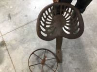 Antique Tractor seat and steel wheel