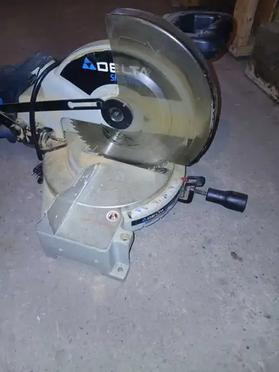 I'm selling a used Delta Shopmaster miter saw, perfect for various woodworking projects. It's in fai...