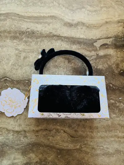 Selling a brand new pair of House of Harlow 1960 faux fur earmuffs with a faux leather headband! The...