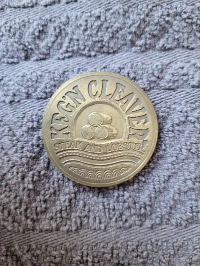 The Vintage Keg'n Cleaver Restaurant Token is a unique collectible. Perfect for collectors or fans o...