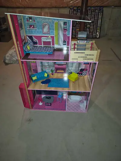Large barbie house with furniture. Has elevator. $30 location is in Paris Ontario