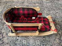 Vintage style wooden sleigh with seat pad
