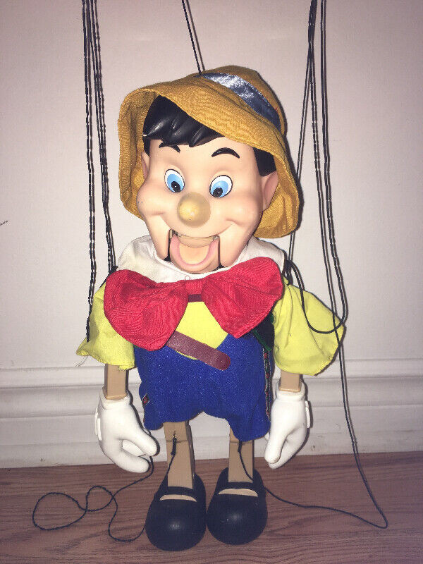 Marionnette à ficelles musicale Pinocchio Disney dans Jouets et jeux  à Laval/Rive Nord - Image 2