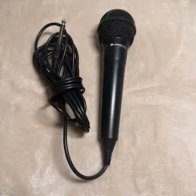 Audio-Technica unidirectional dynamic microphone with attached cable and 1/4” plug. Great for karaok...