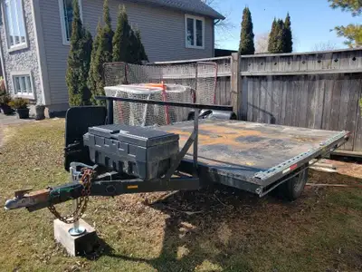 Flatbed trailer 9' x 7.5', used for towing 2 ATVs. Comes with brand new tires, storage lock box, lig...