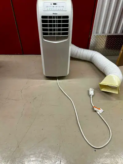 Haier Window AC unit (Portable) 10,000 BTU Used a handful of times. Yellow on top of top of unit due...