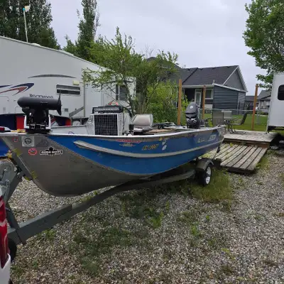 16 ft edson made in manitoba aluminum fishing boat. 50 hp mercury 2 stroke motor with electric start...