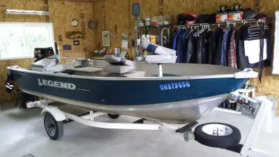14' Legend Pro Sport (Deep and Wide) with 30 HP Mercury (2 stroke) and ShoreLander trailer with spar...