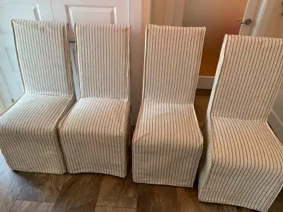Four slip-covered dining room chairs. Excellent condition. Lightly used. Price is $50 for all four t...