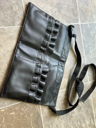 Authentic MAC brush belt, perfect for makeup artists or beauty enthusiasts. Designed to hold multipl...