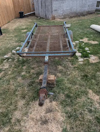 1995 rainbow tilt deck trailer. Deck measure's 9 feet long and 4 feet wide. 1500lb axle on 12"rubber...