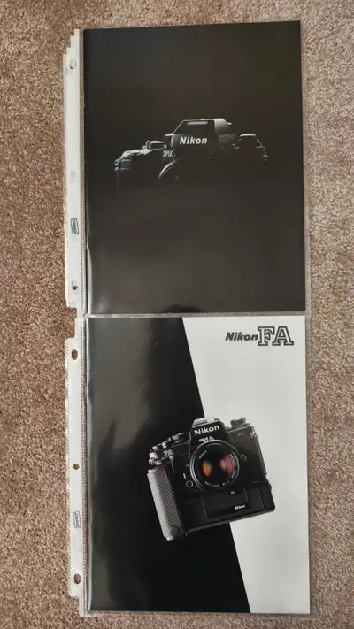 A large set of various Nikon brochures, pamphlets, or catalogs of past Nikon main professional and a...