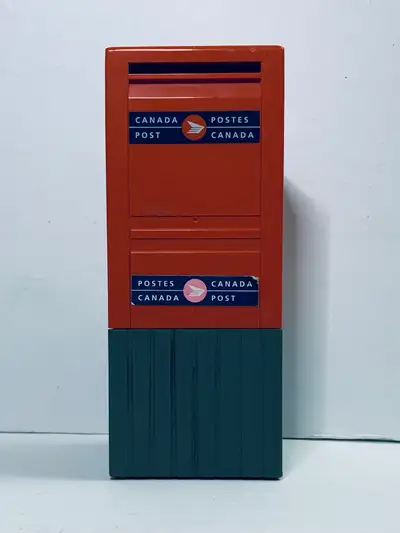 This vintage Canada Post mailbox coin bank is a nostalgic collectible, capturing the charm of Canadi...