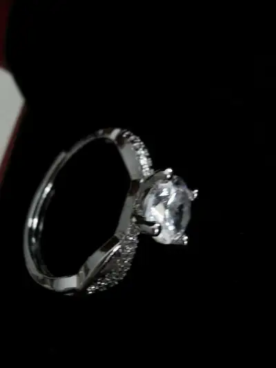 This elegant ring features a sparkling 6.5mm 1.0ct D colour grade moissanite stone, set in a delicat...