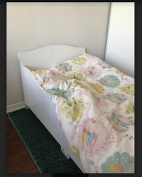 Adorable toddler bed with mattress, sheets and duvet.