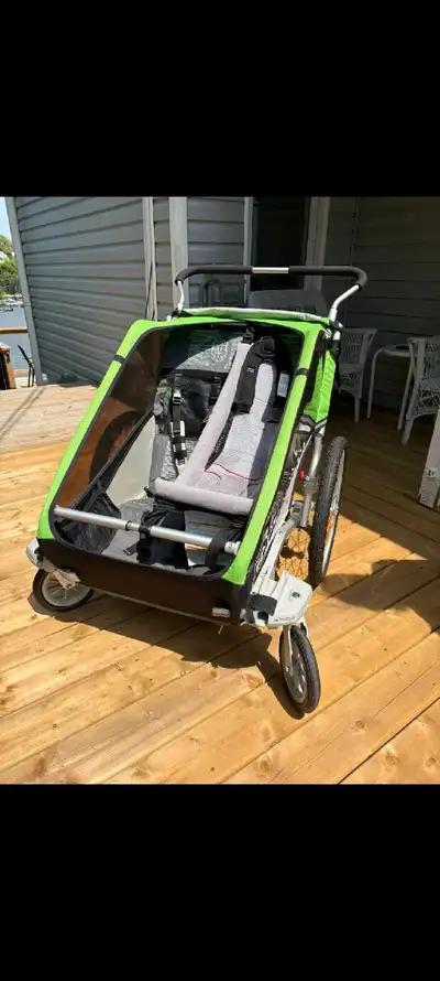 Chariot Cheetah 2 double stroller. Comes with infant sling, bike attachment, and flag. Built in suns...