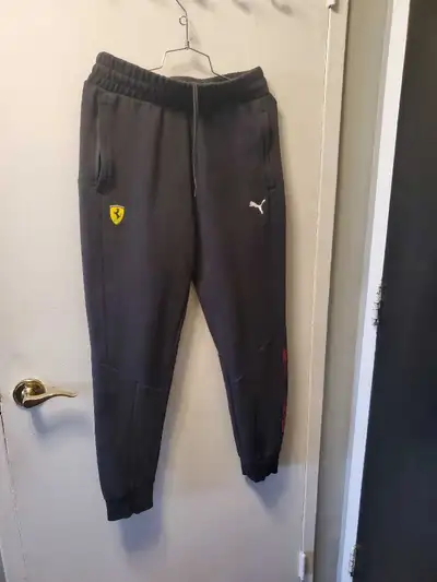 I have a Puma Ferrari track pant in size medium. It is in good condition. Additionally, I have an Ad...