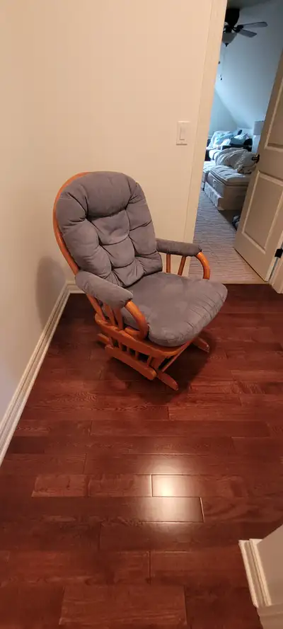 Solid wood nursing glider with matching gliding foot rest., View more