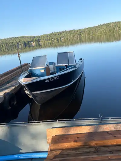 90s 18 foot lund boat with cannon down riggers, electric trolling motor to match the 90hp 2 stroke m...