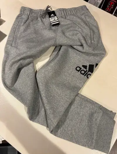 ADIDAS - TWO - PAIRS GREY JOGGING PANTS - BRAND NEW - OBO ., View more