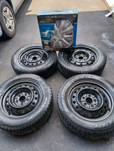 FOR SALE 4 16 INCH HANKOOK I PIKES SNOW TIRES-SIZE 215/60 R16 WITH A SET OF BRAND NEW WHEEL COVERS I...