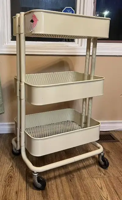 Sturdy and functional with three tiers. Movable with smooth-rolling wheels. Works great.