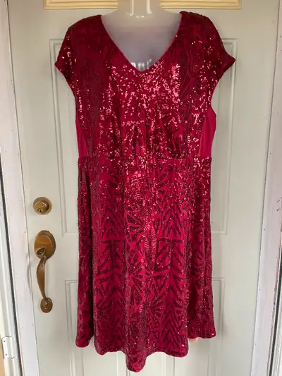This is a NEW stunning dark red sequin dress that shimmers. The sequins are sewn on in a geometric p...
